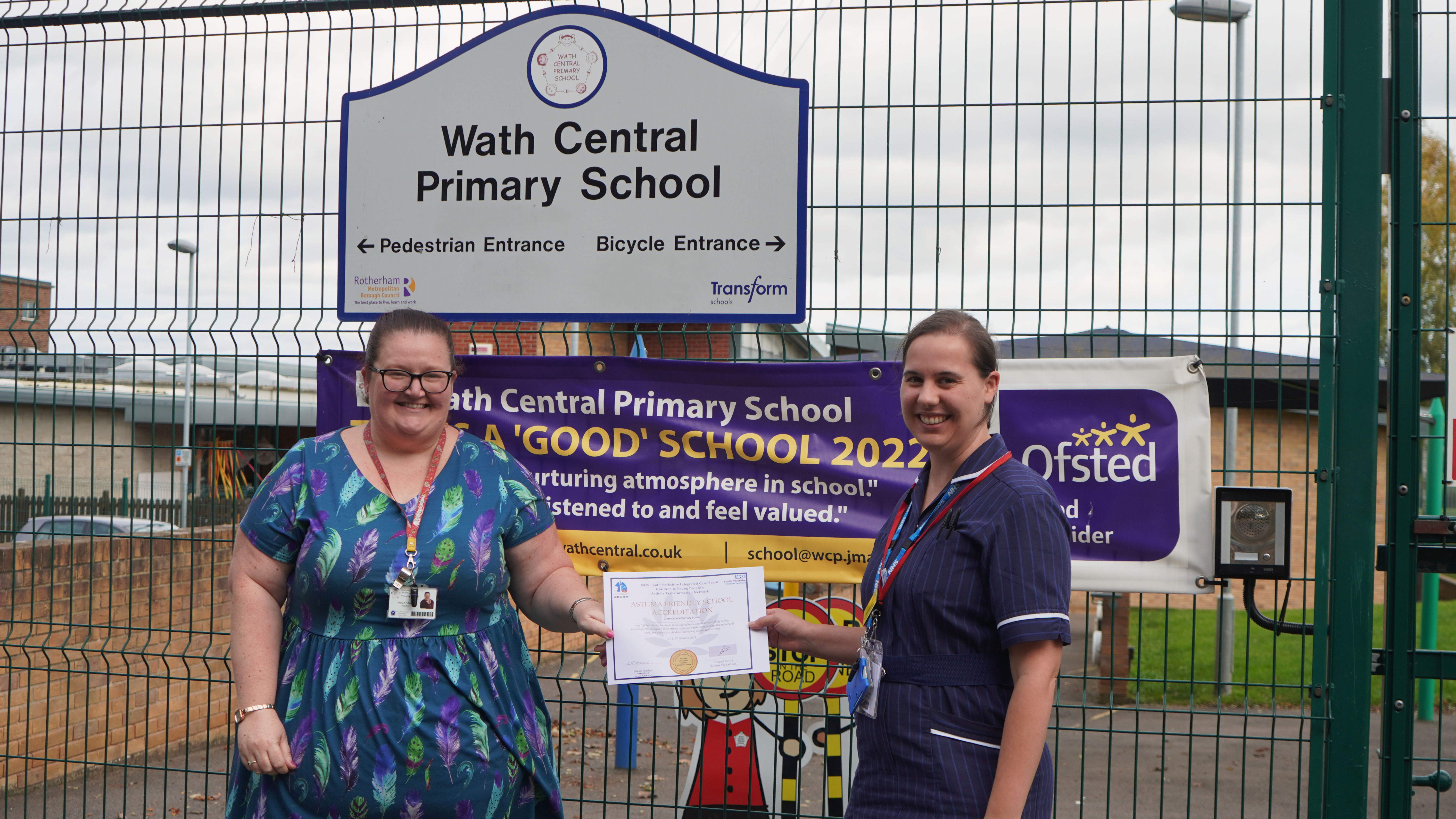 Amy Shaw (Assistant Headteacher  at Wath Central Primary) and Hannah Lee (Asthma Specialist Nurse) holding the school's Asthma Friendly initiative accreditation certificate.
