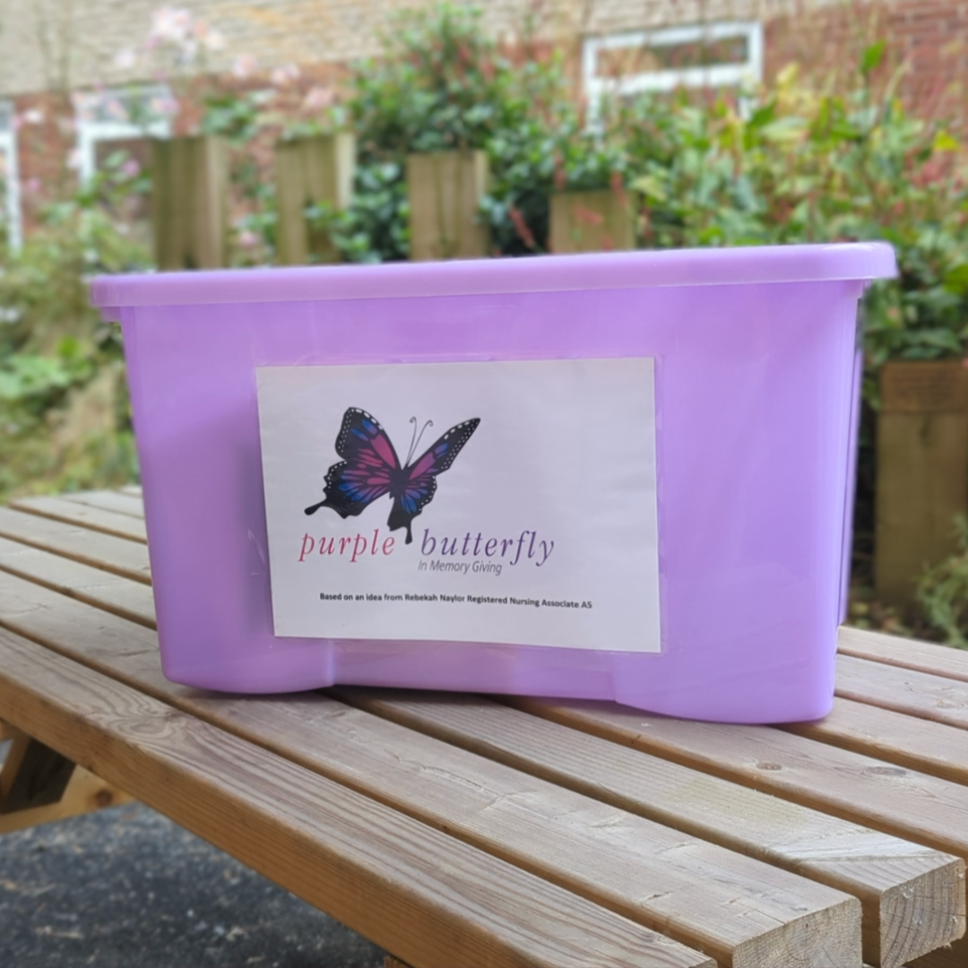 The image shows an example of a Purple Butterfly in Memory Giving model of care box.