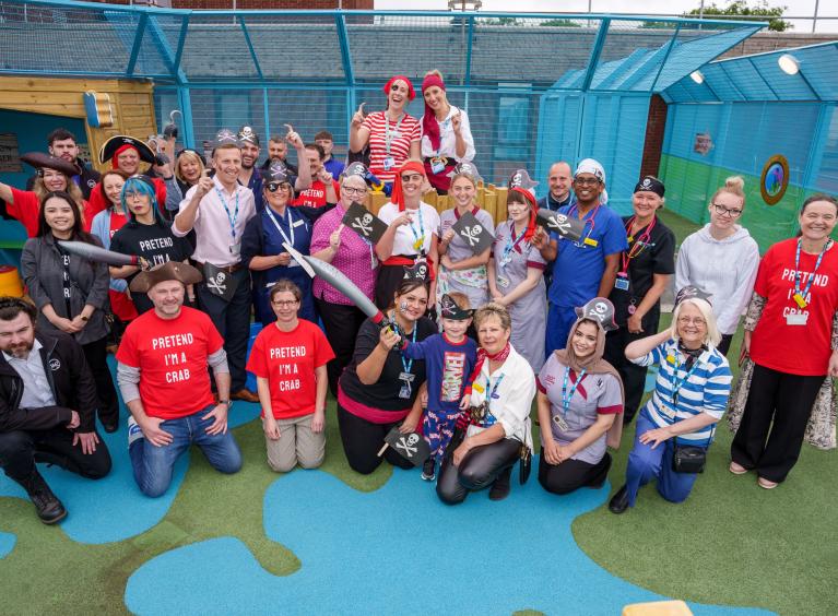 I&G and NHS staff dressed as pirates at the opening of the rooftop play area