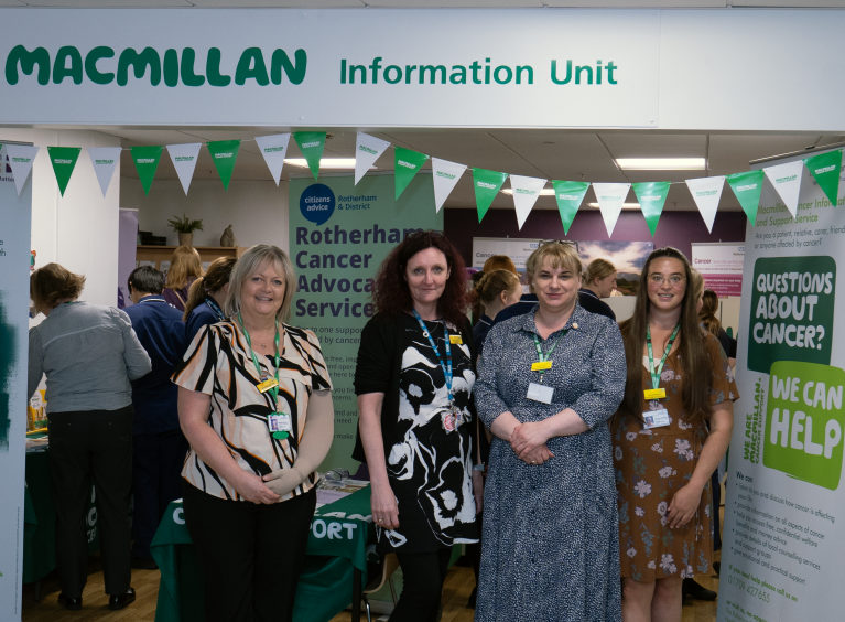 Members of the cancer and nursing teams standing in front of the recently reopened Macmillan service