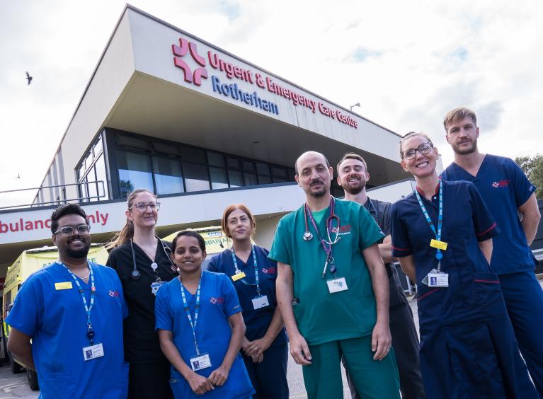 Eight members of the UECC team stood in front of Rotherham's Urgent and Emergency Care Centre