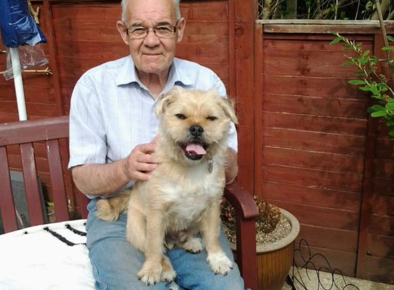 Sally's Dad happily sat with his beloved dog. 