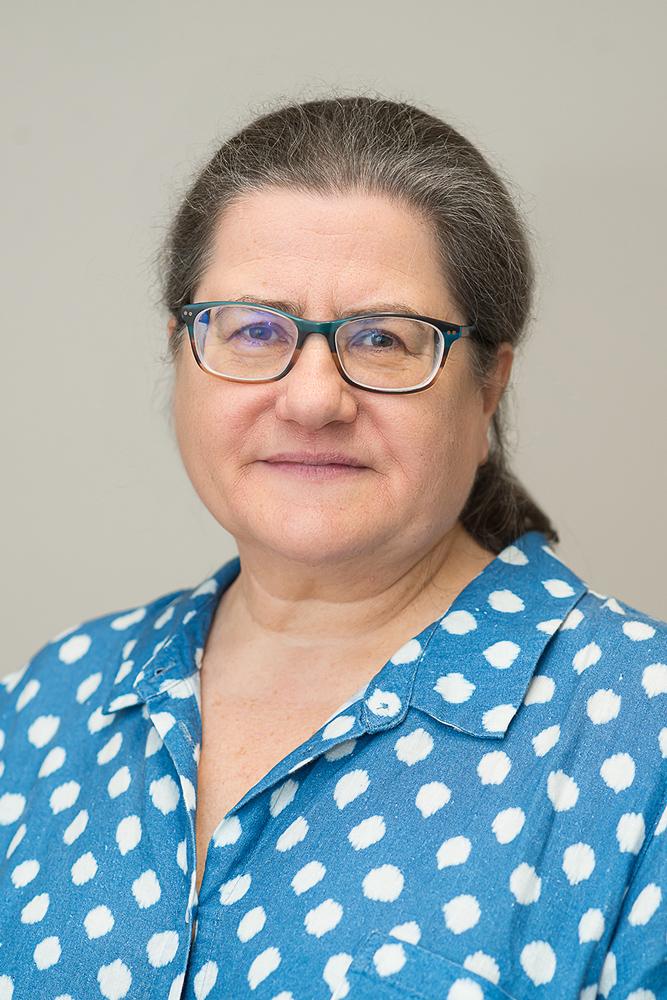 Julia Burrows wearing a blue top with white dots