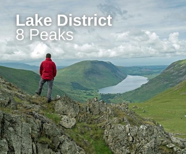 A walker standing at the top of a mountain in the Lake District. With the words Lake District 8 Peaks